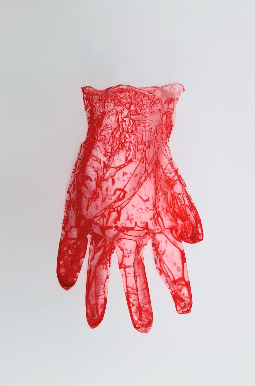 Care Worn (Cross) by Sarah D’Souza, Vinyl glove, acrylic paint