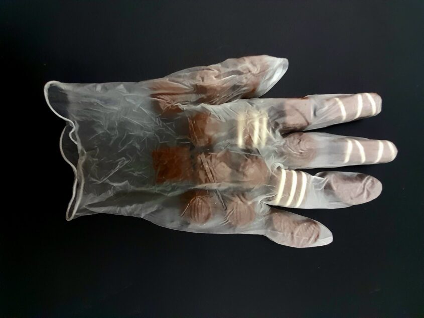 Care Worn (Give) by Sarah D’Souza, Vinyl glove, chocolates